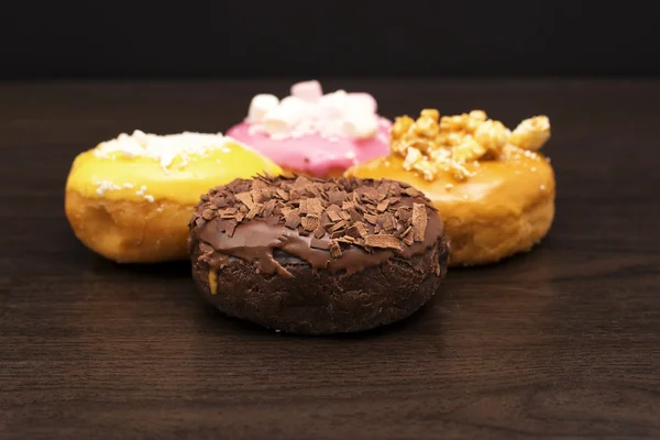 Fresh baked assorted donuts  — Photo